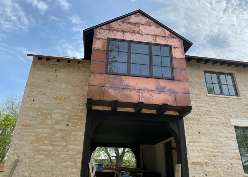 Copper metal panel facade on a stone building for Skylight Installation in San Anselmo